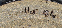 The inscribed mark on a Ken Sadler hand thrown pottery juicer