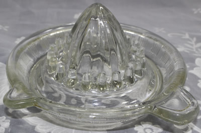 A Crown Crystal Glass Type 3 clear glass juicer