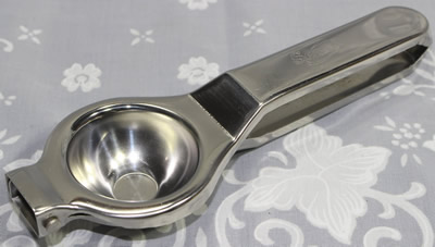 A Senso stainless steel squeezer juicer