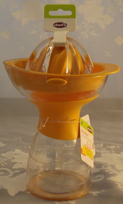 Orange and clear plastic measure Chef'n juicer