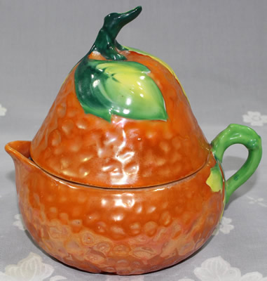 Orange, yellow and green pear shape juicer