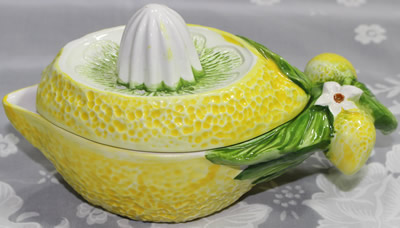 A 2 piece ceramic juicer in the shape of a lemon