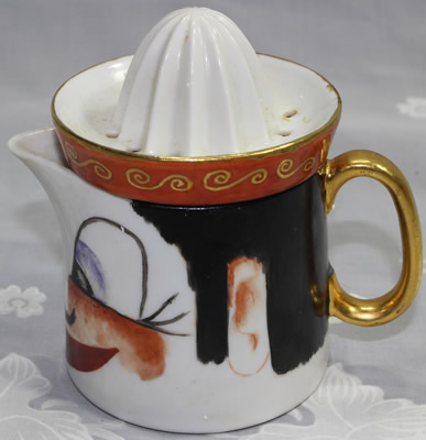 A handpainted buck toothed face juicer