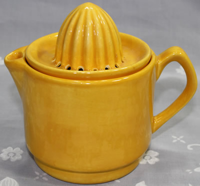 Orange 2 piece ceramic jug juicer with rivets