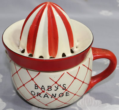 Red on white BABY'S ORANGE juicer with lattice pattern