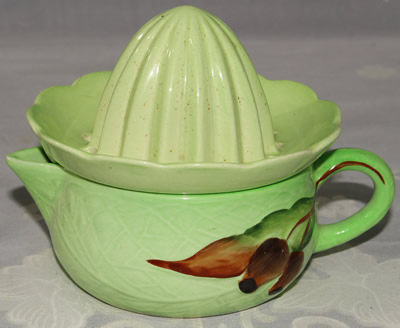 Carlton Ware pale green 'Gumnut ' juicer with matching green top