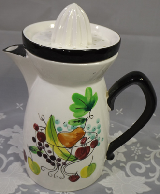 Banana, pear and cherries  on white & black ceramic juicer set