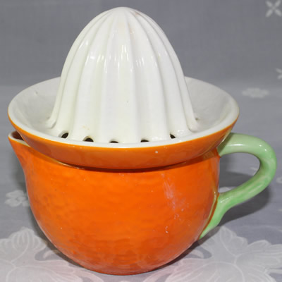 Crown Devon orange 'peel' and white 2 piece juicer