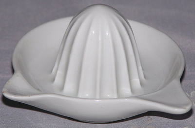 White ceramic saucer shape juicer