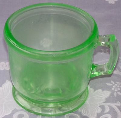 Unusual green glass juicer jug