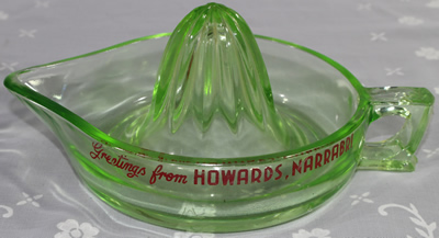 Large green Crown Crystal juicer with advertising