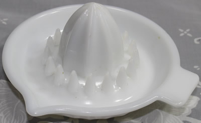 White milk glass panelled saucer juicer