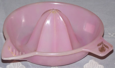 Pink Associated Plastics plastic saucer juicer