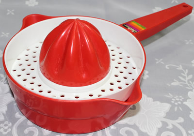 A red and white Decor plastic pot shape juicer