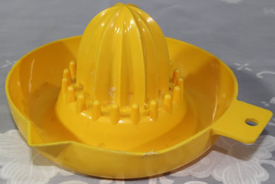 Yellow plastic saucer juicer